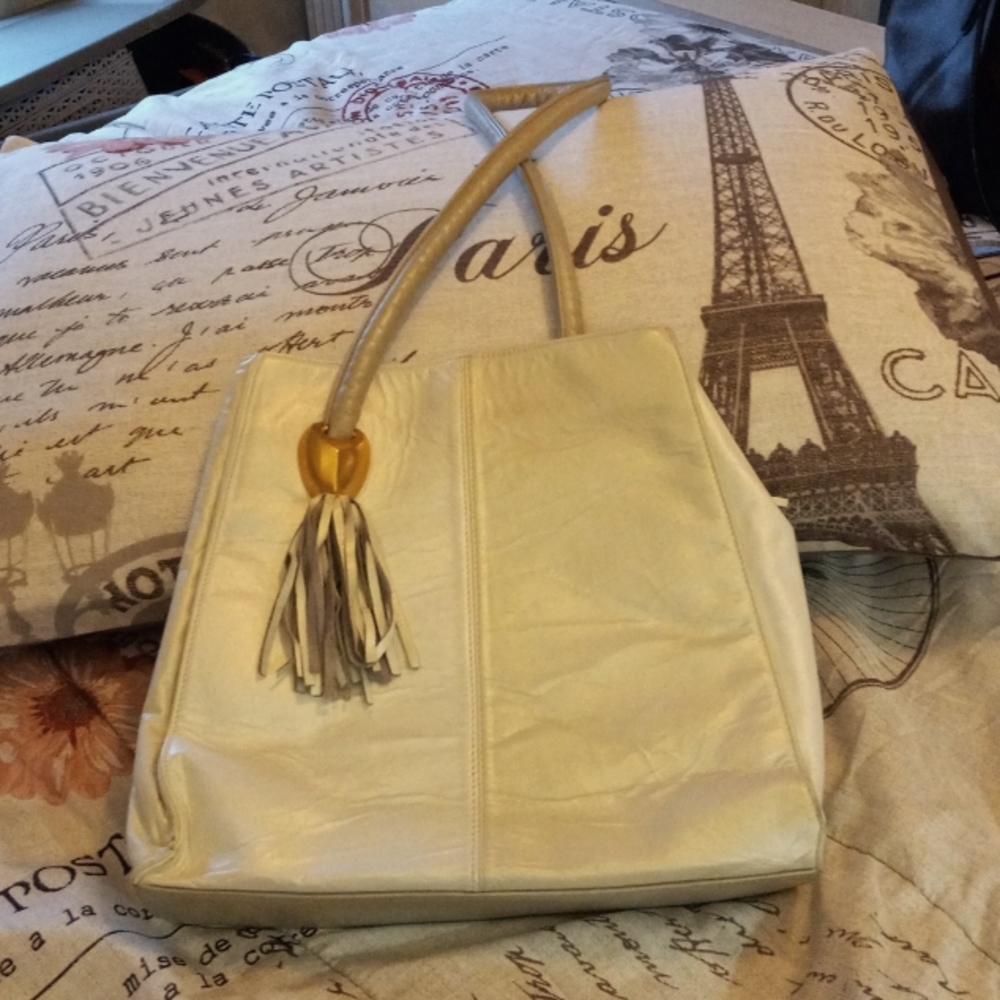 GENUINE leather white/off white purse.  Very unique shape with shoulder strap.